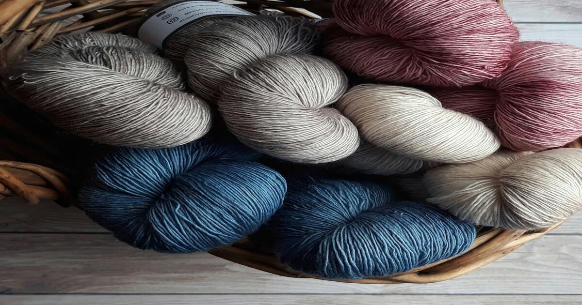 A basket full of Egyptian cotton yarns in multiple colours.