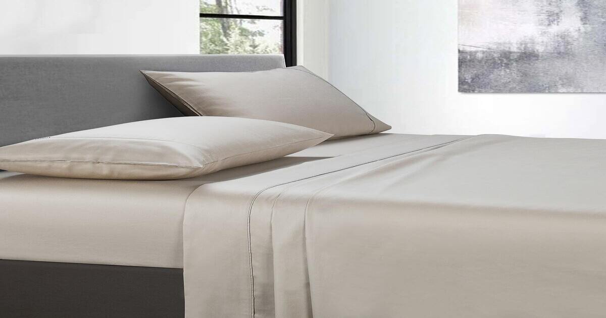 White cotton split king bed sheets.