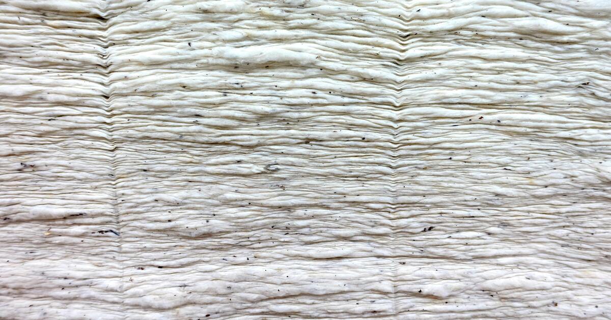 An image of layers of pre-processed cotton fabric.